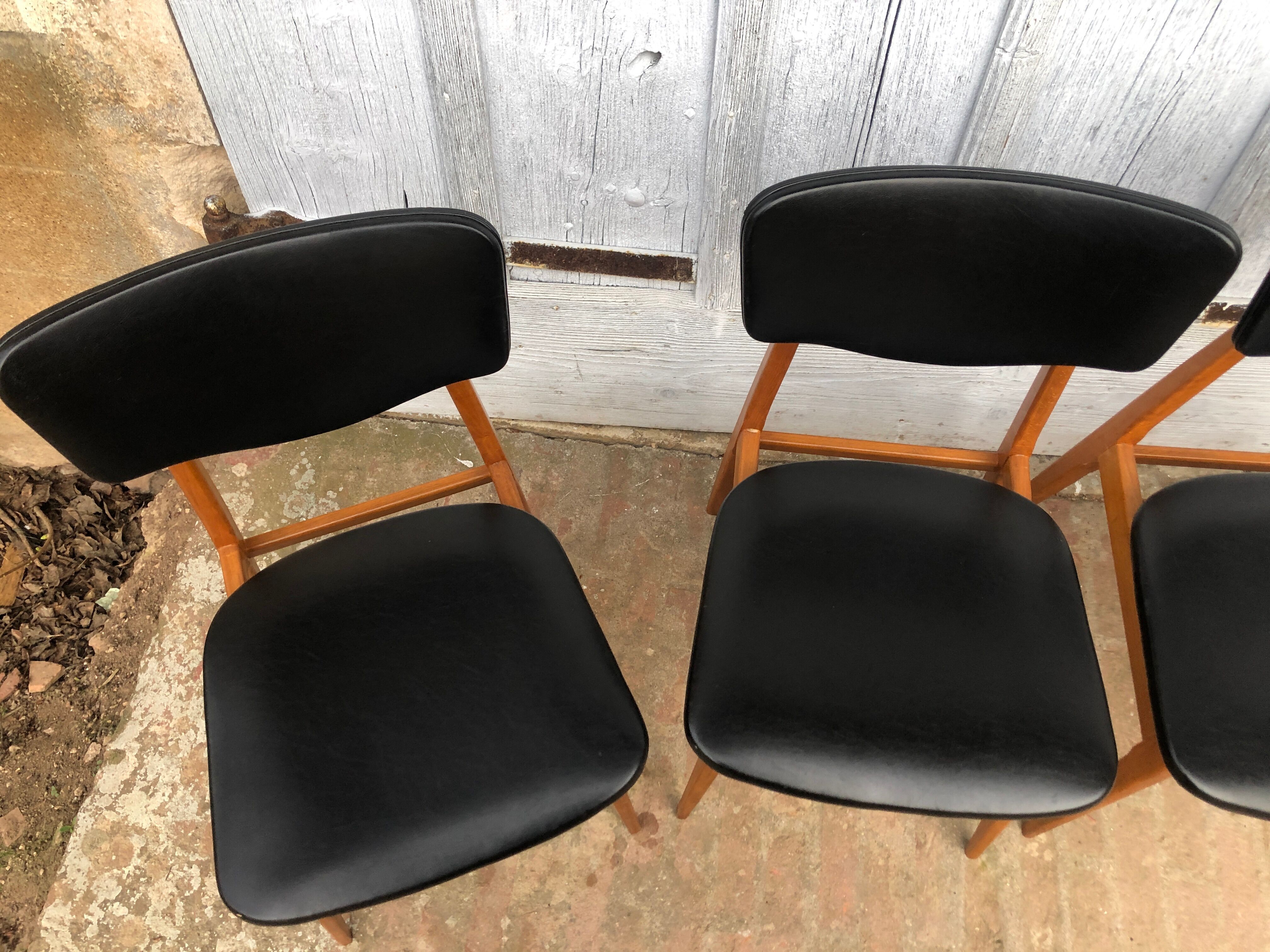 Set of 4 Scandinavian teak and black skai chairs