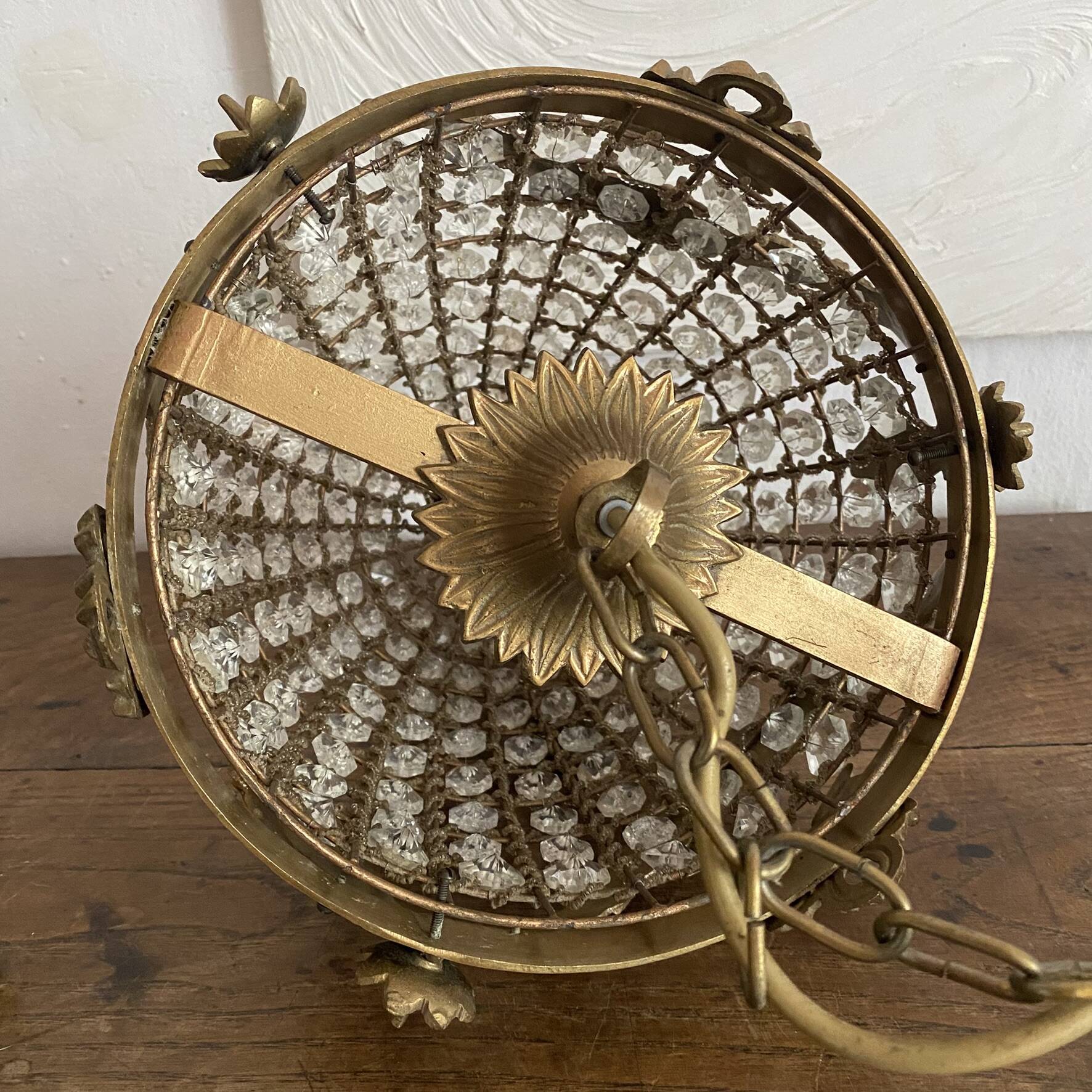 Brass basket chandelier with Louis XVI style pendants.