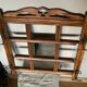 Art Deco wall-mounted coat rack in oak, early 20th century. Beveled central mirror