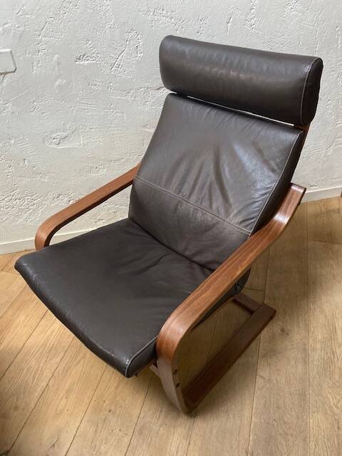 Leather armchair with footrest