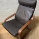 Leather armchair with footrest