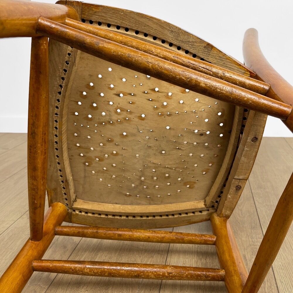 Pair of curved wood bistro chairs and studded and perforated seat