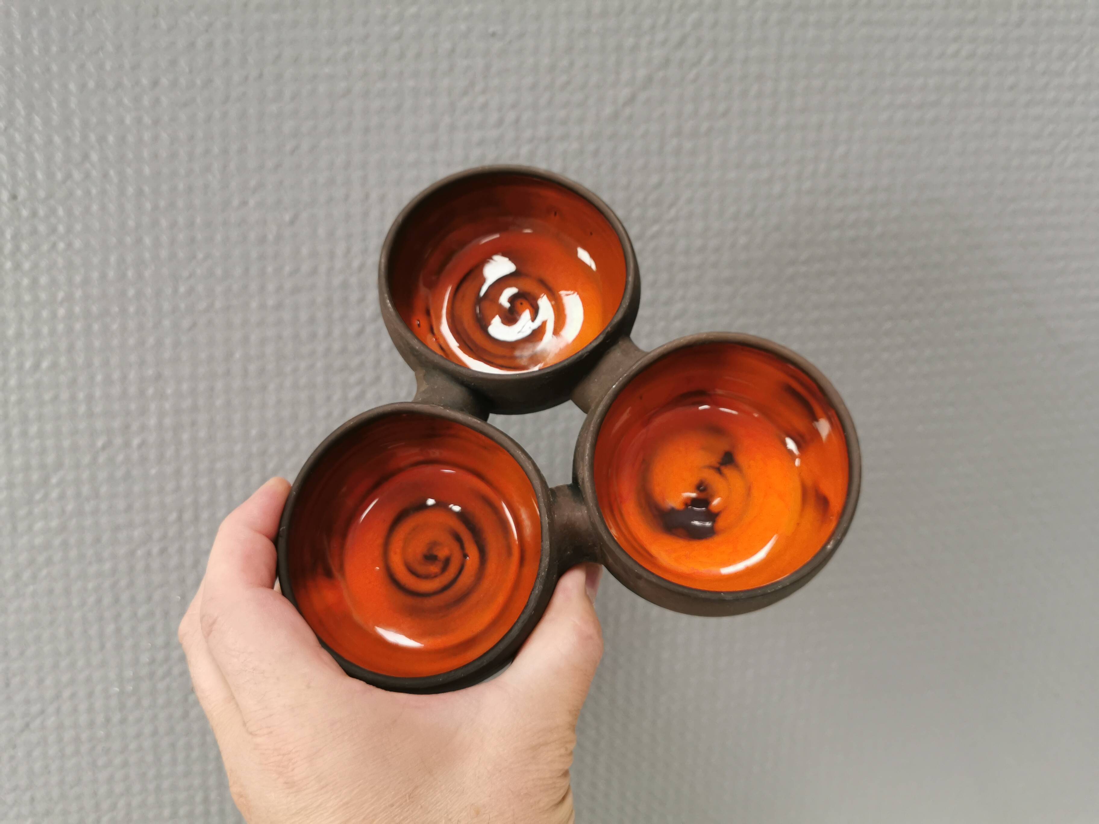 Beautiful bowl (composed of 3 bowls) with orange/red glaze inside