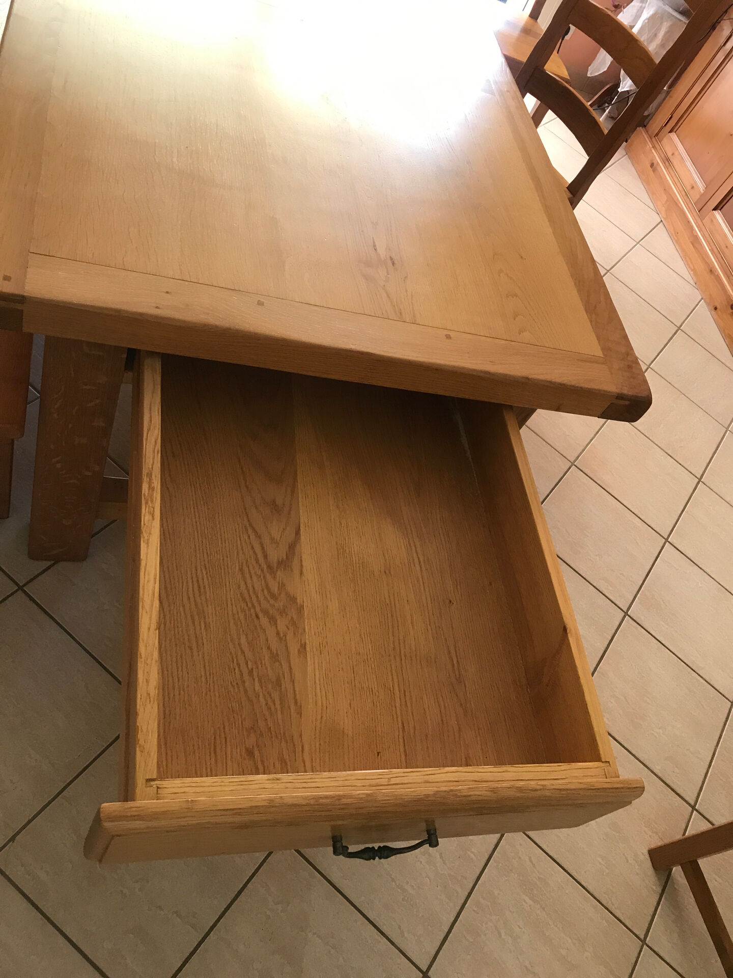 Solid oak dining table made by a craftsman cabinetmaker.