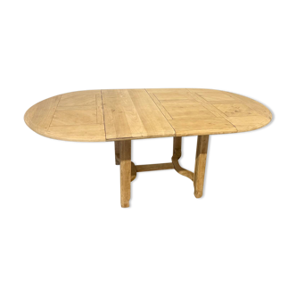 Old renovated round farm table with two extensions