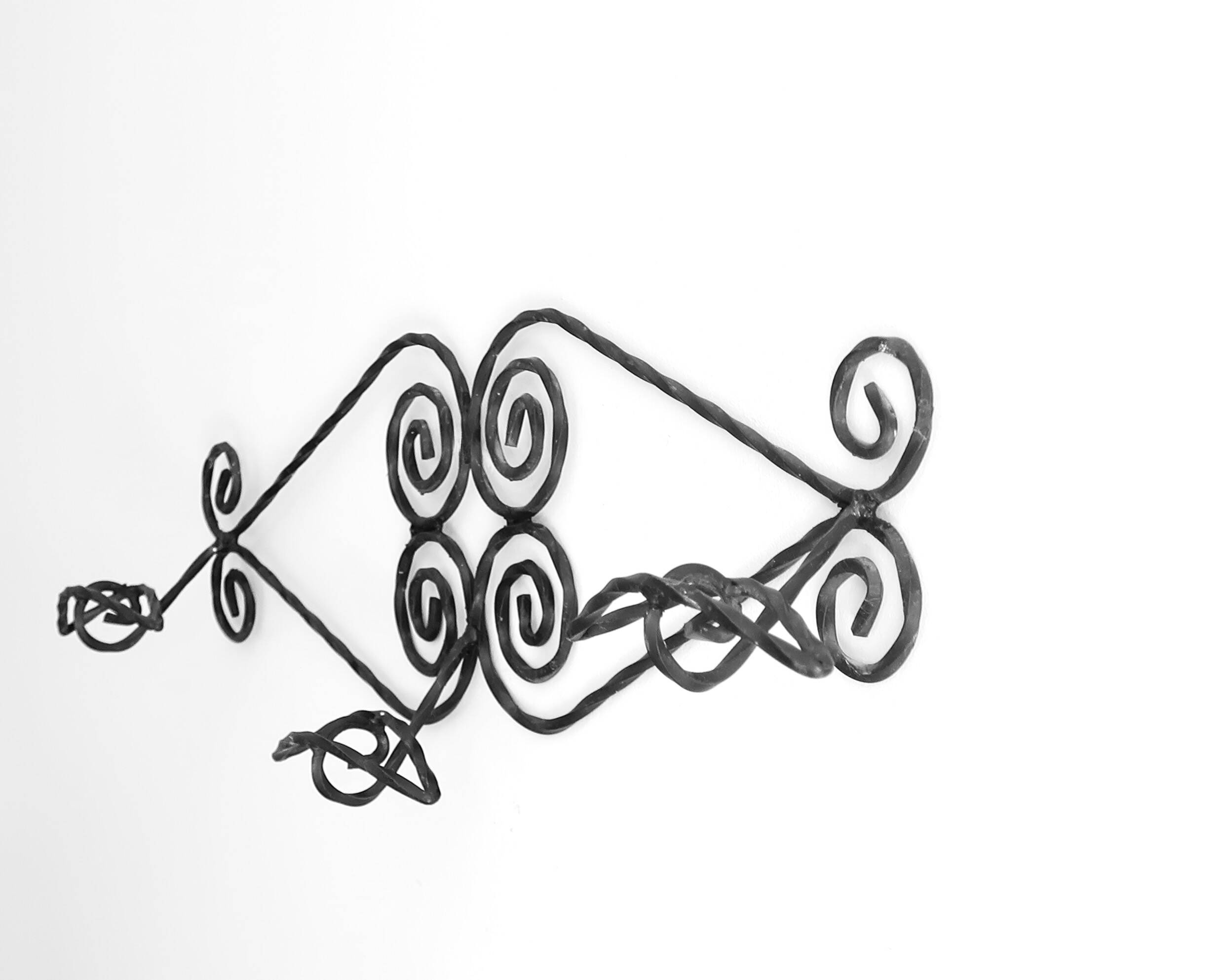 Twisted wrought iron wall coat rack with three hooks
