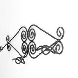 Twisted wrought iron wall coat rack with three hooks