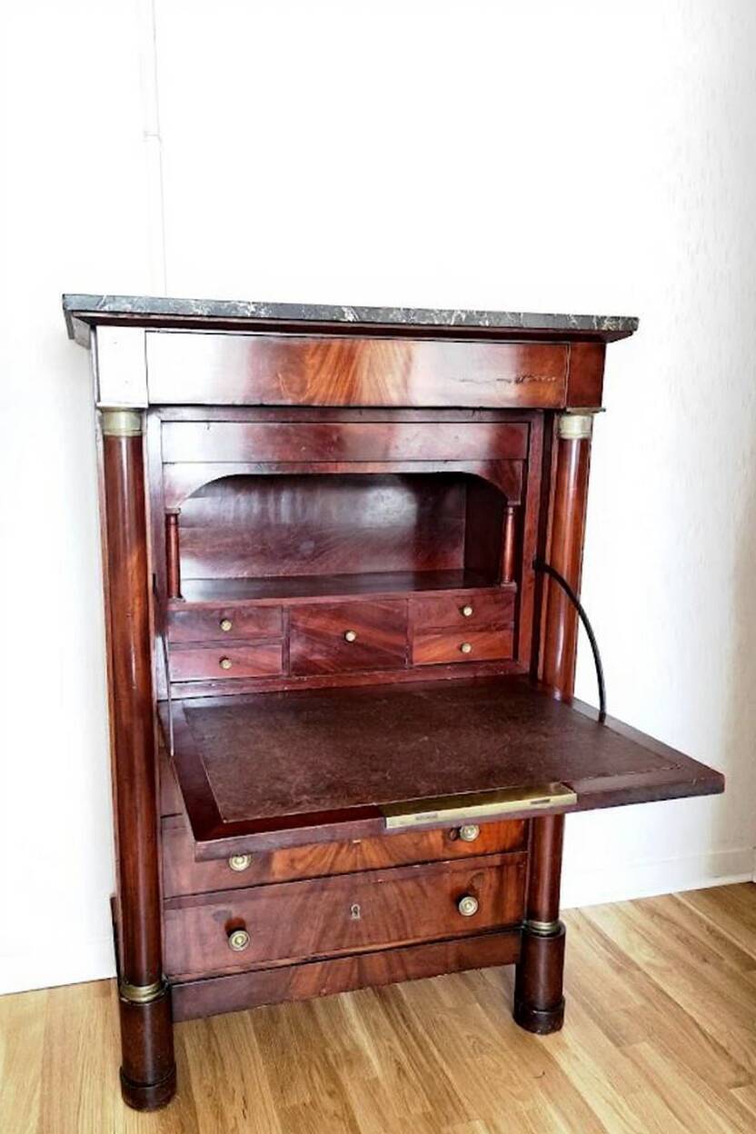 Empire secretary with openwork.