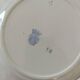Set of 8 ironstone plates with coordinated designs.