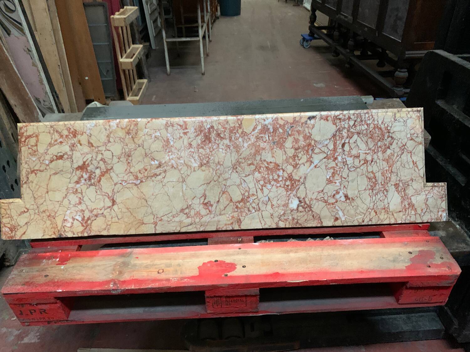 Louis XIV-style fireplace has 19th century veined pink marble hood