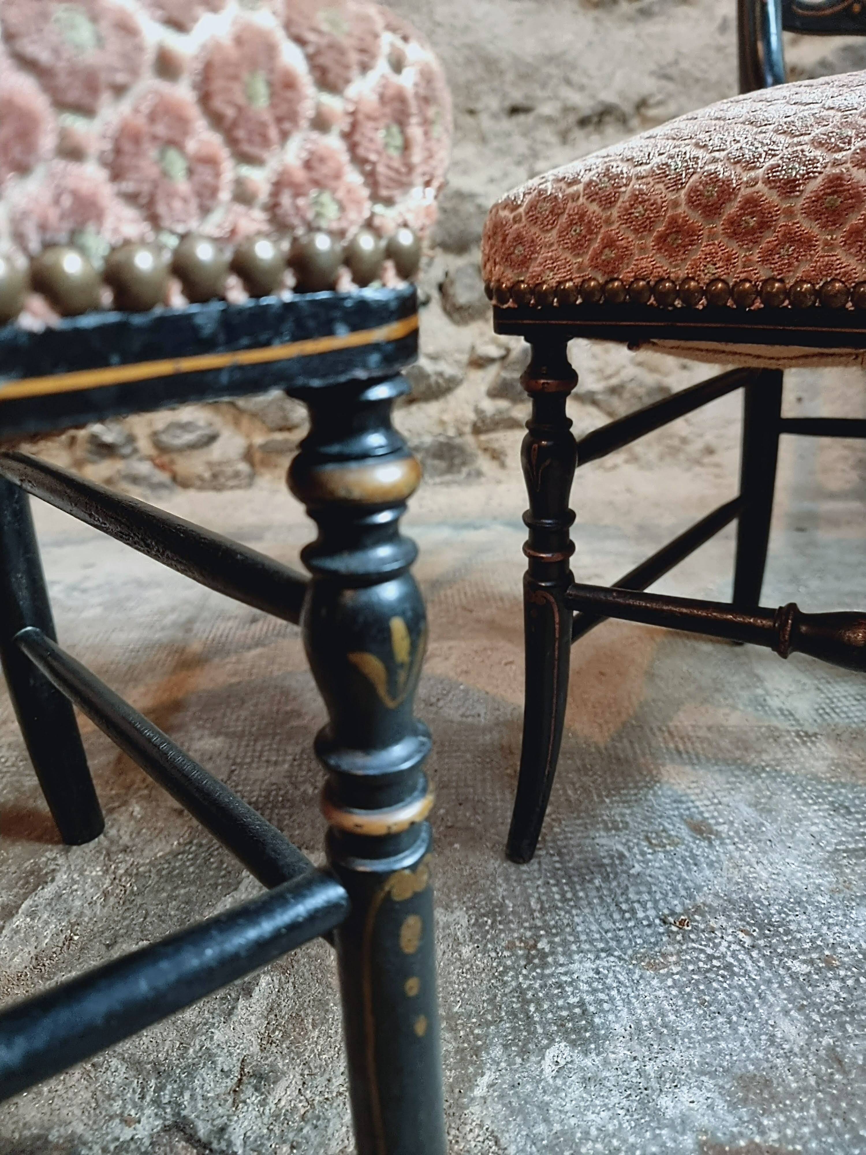 Pair of antique Napoleon III chairs in blackened wood and fabric.