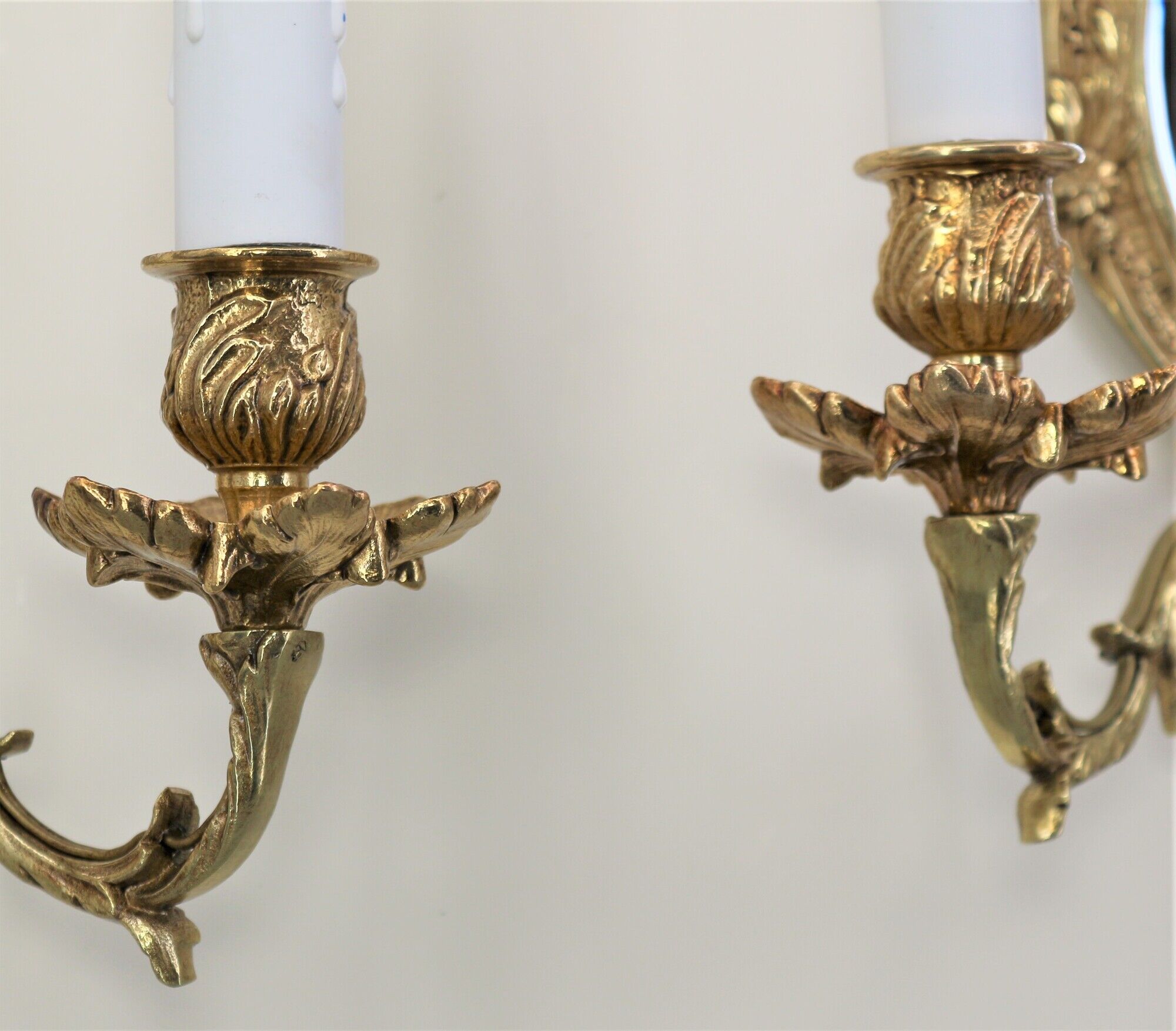 Pair of louis XV beveled mirror wall lamps in bronze by "Lucien Gau"