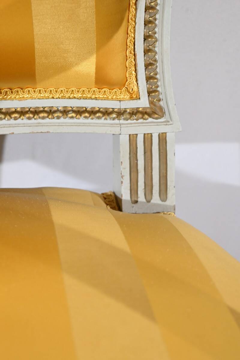 Pair of Cabriolet Armchairs, in rechampi wood, Louis XVI style – Late 19th century