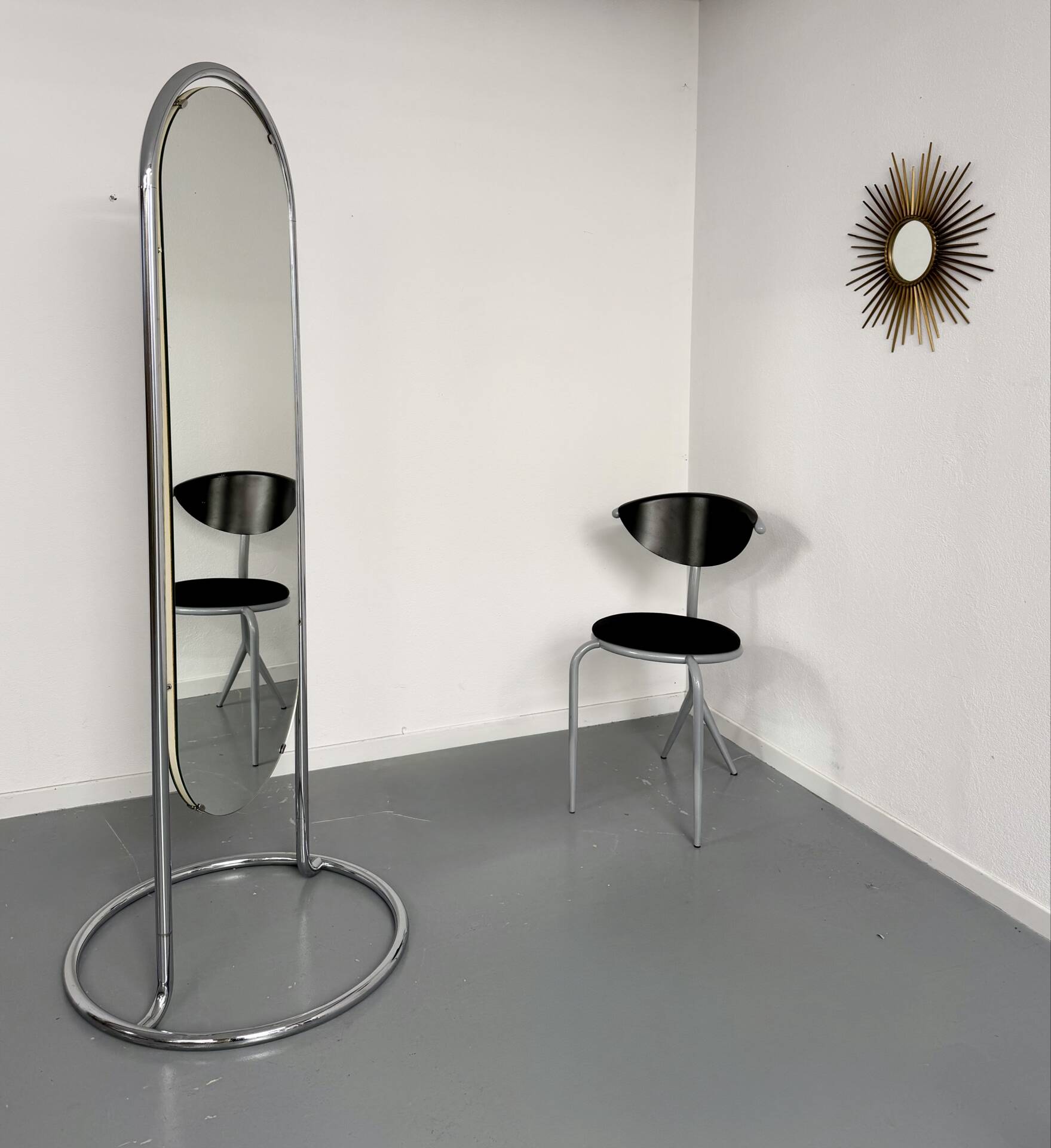 Large freestanding chrome metal full-length mirror in 1970s design.