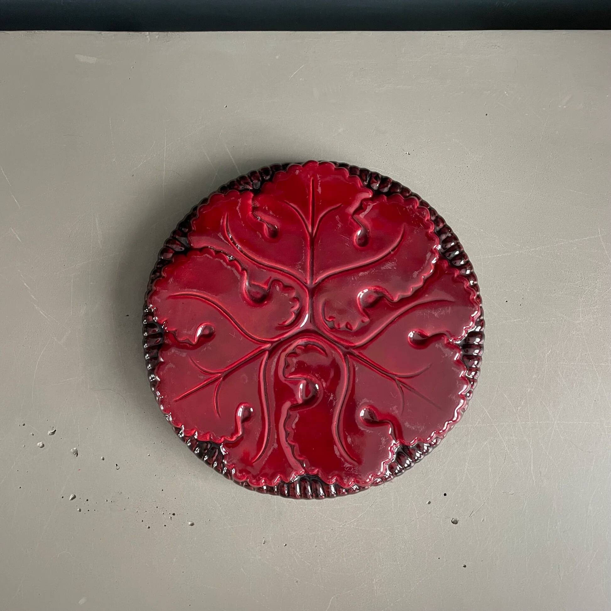 Burgundy ceramic trivet
