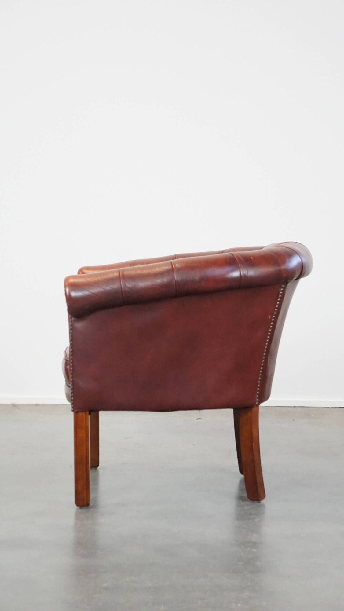 Red cow leather English chesterfield club chair