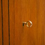 Highboard in teak wood with grooved doors,