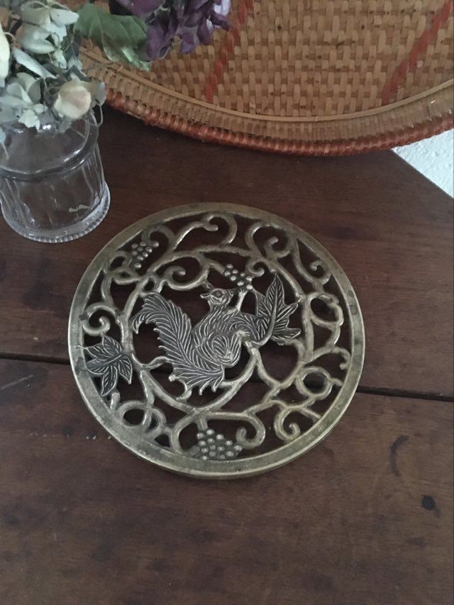 Underneath the brass dish
