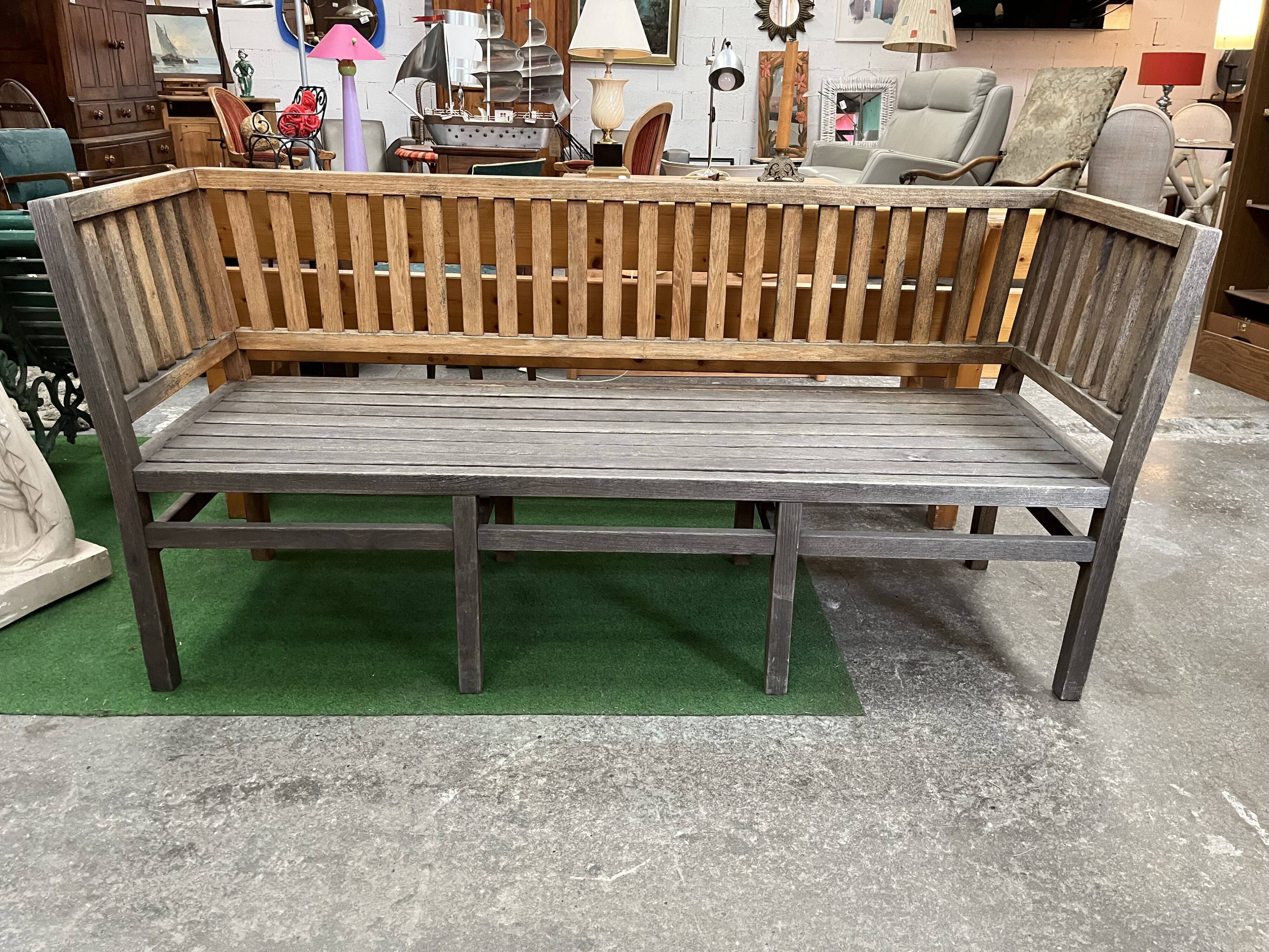 Colonial-style teak bench