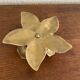 Brass flower candle holder.
