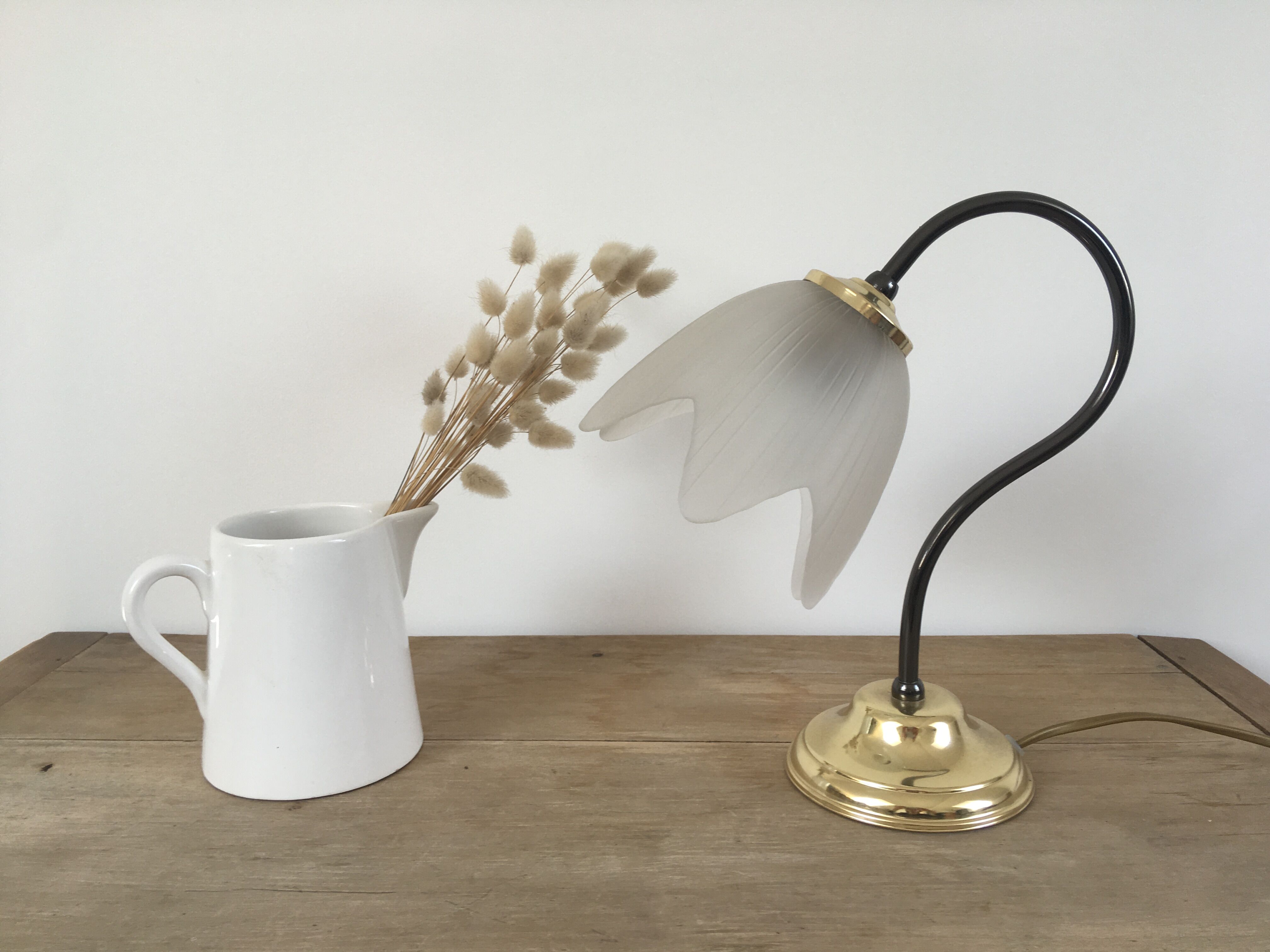 Table lamp with glass globe and brass foot