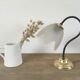 Table lamp with glass globe and brass foot