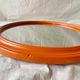 Vintage round wall mirror in orange painted wood - diameter: 48 cm