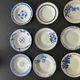 Set of 9 vintage deep plates with blue patterns.