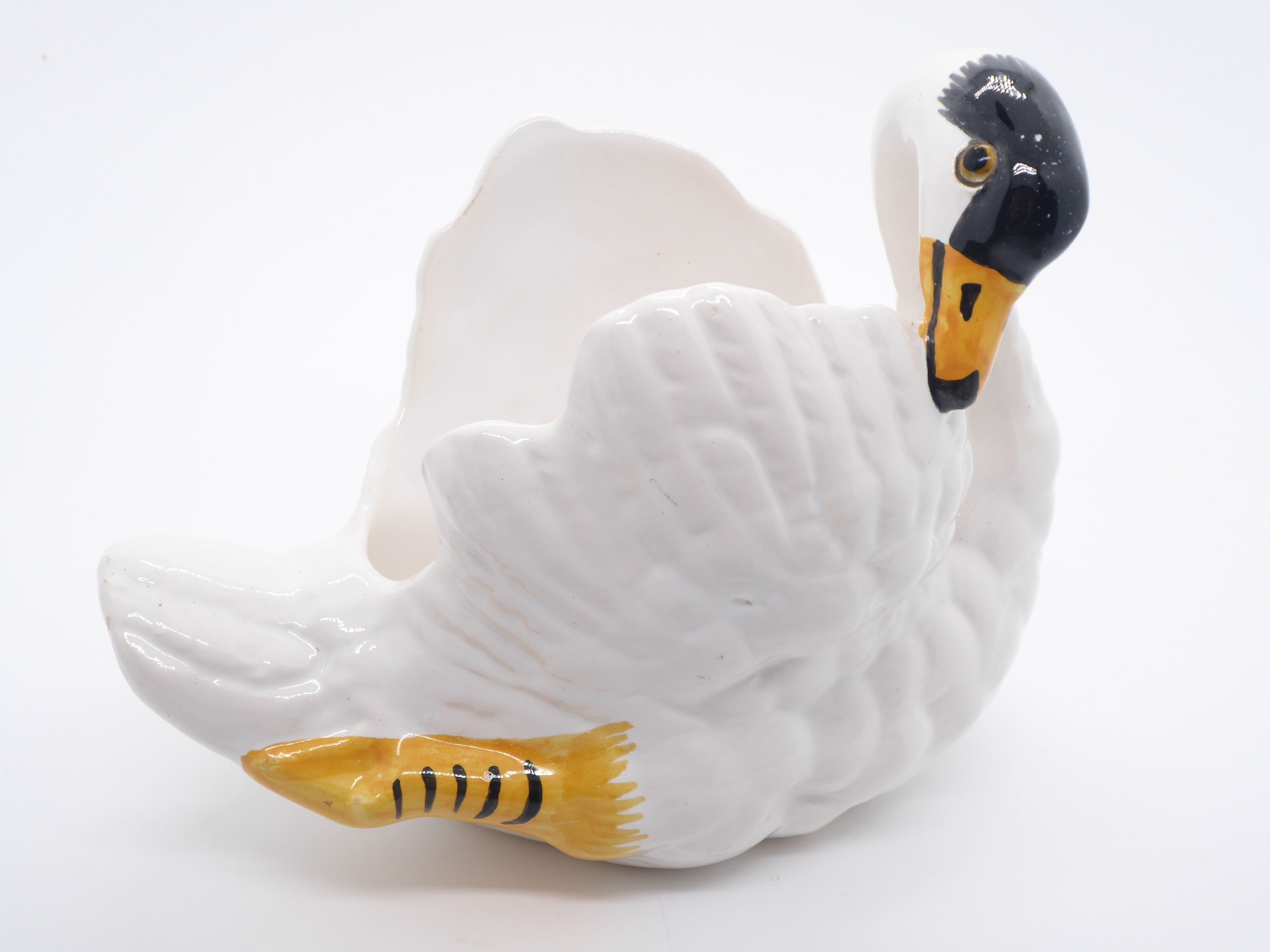 Ceramic pot cover in the shape of a swan