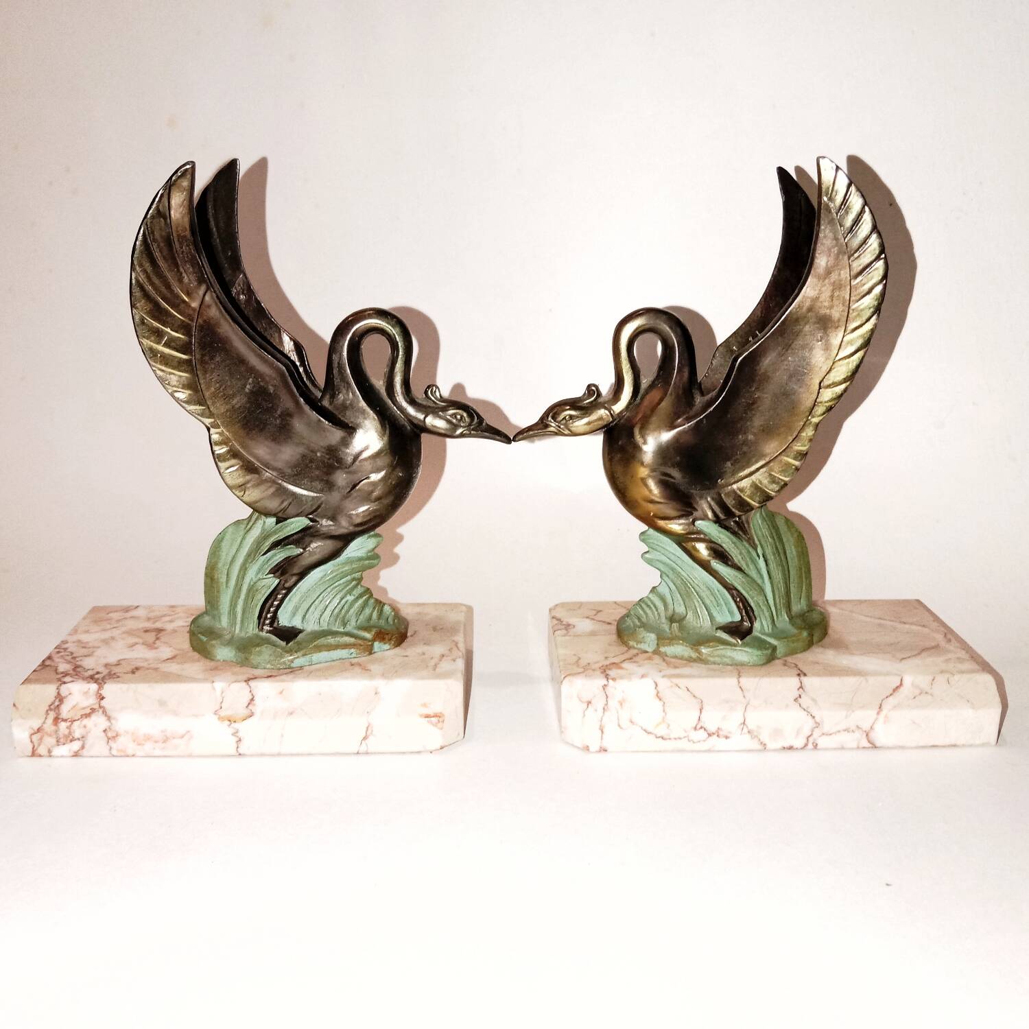 Art Deco bookends with metal swans, double patina and marble base.
