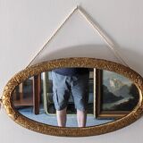 Art Deco oval mirror in gilded wood, France circa 1920