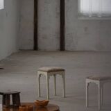A pair of antique Danish stools, seats in lambswool, late 19th century.