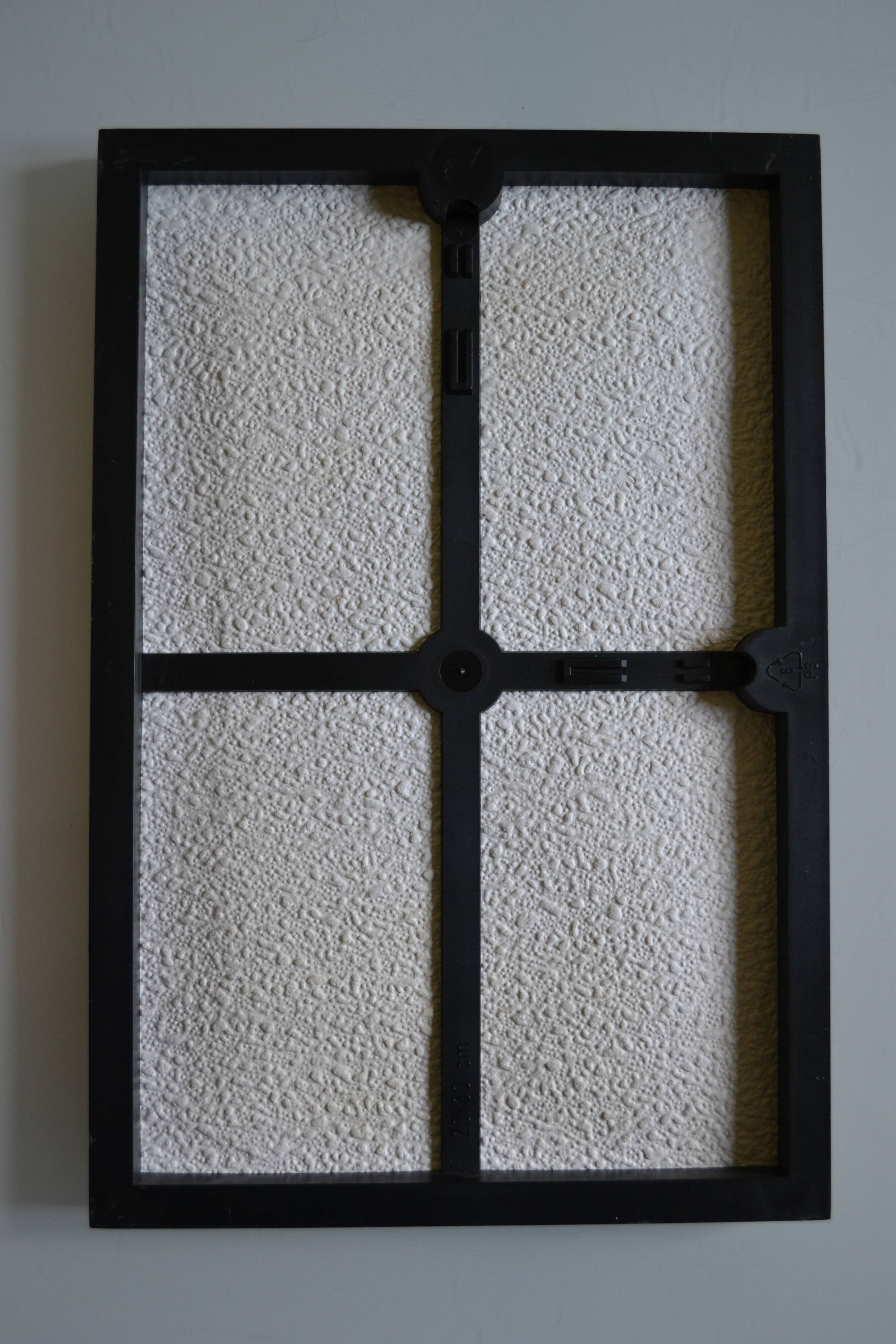 Framed abstract painting under glass