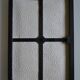 Framed abstract painting under glass