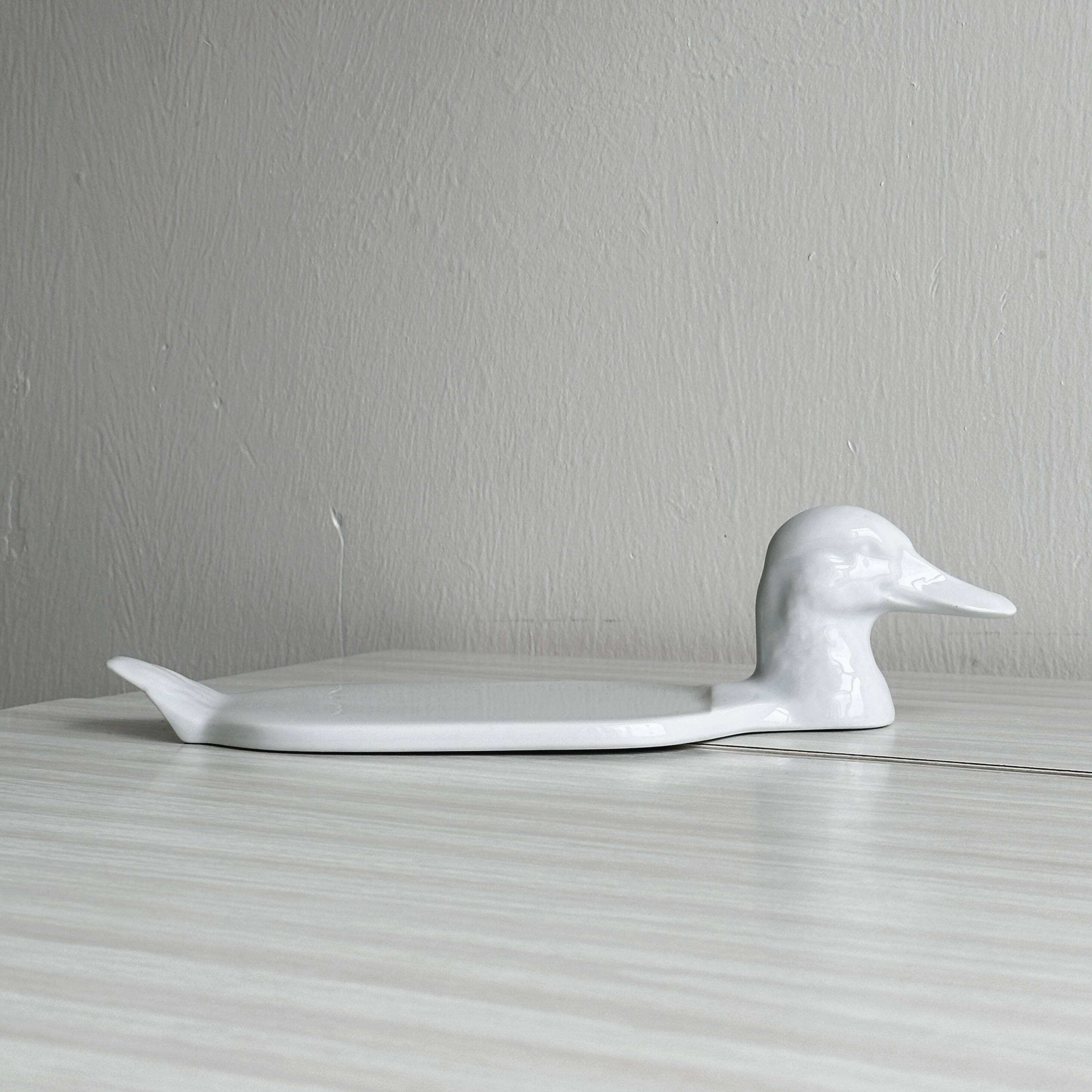 White porcelain dish in the shape of a duck.