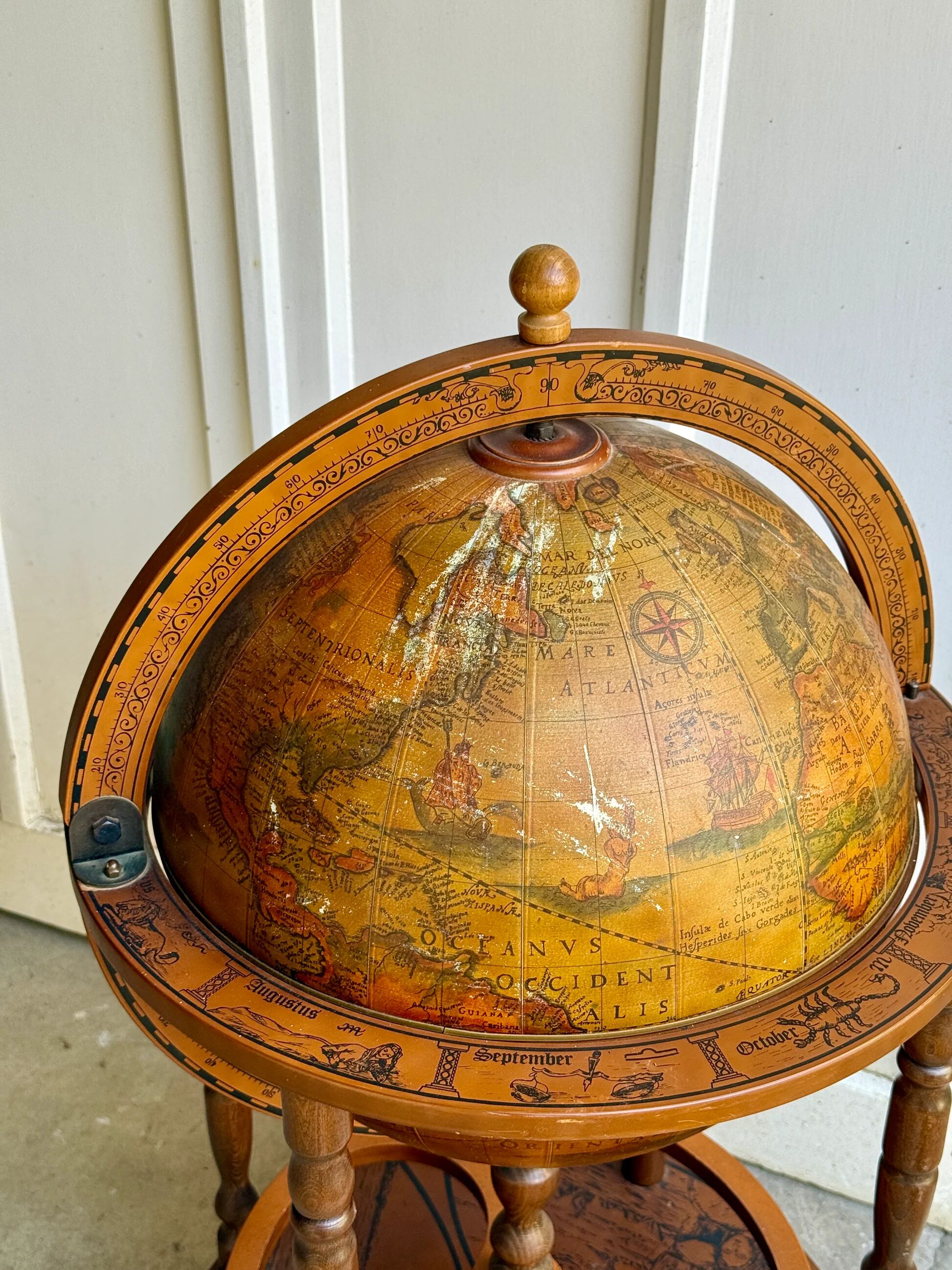Globe bar on wheels with a rotating tray