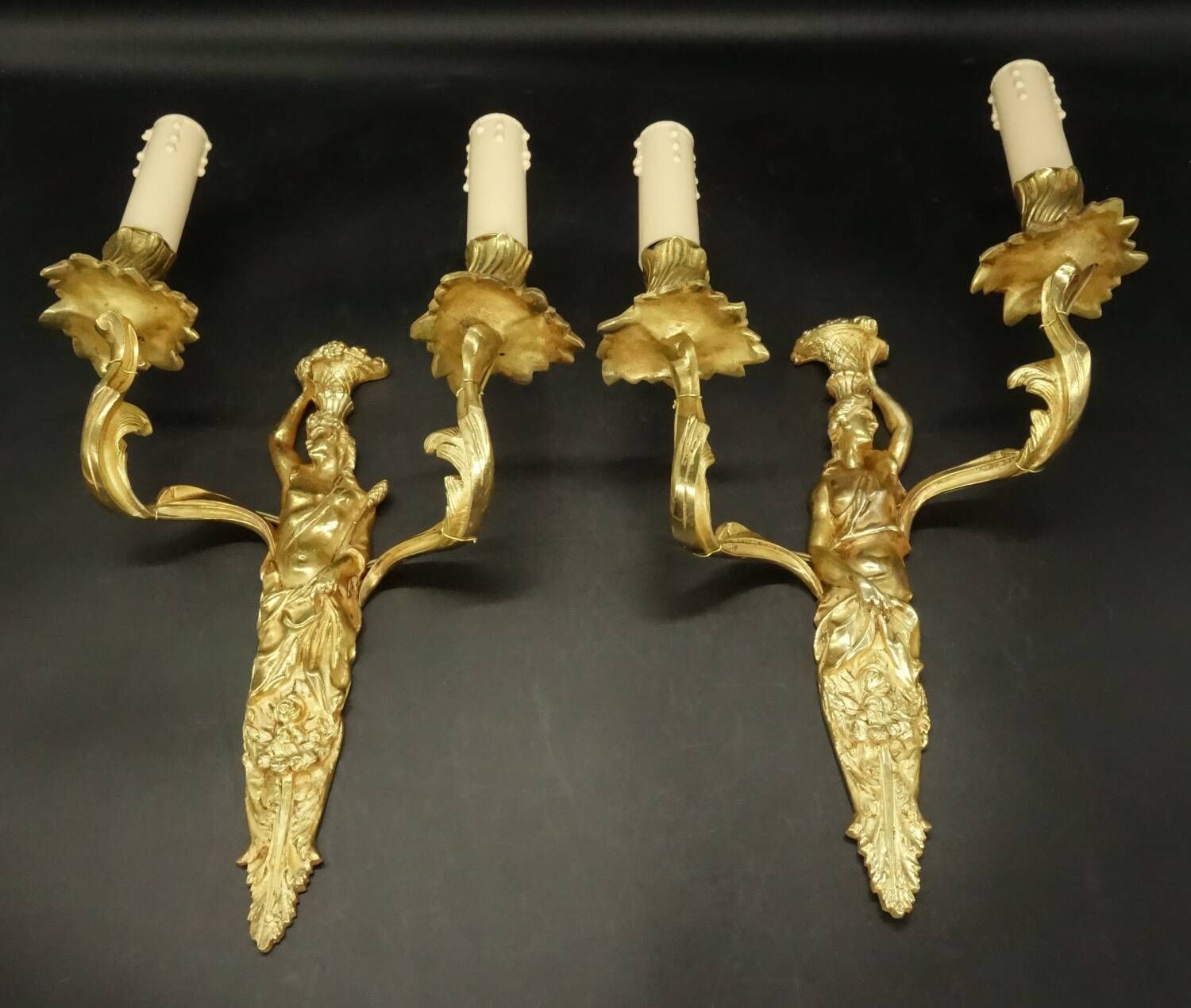 Pair of large caryatid wall sconces in Louis XV style from the 19th century - gilded bronze.