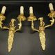 Pair of large caryatid wall sconces in Louis XV style from the 19th century - gilded bronze.