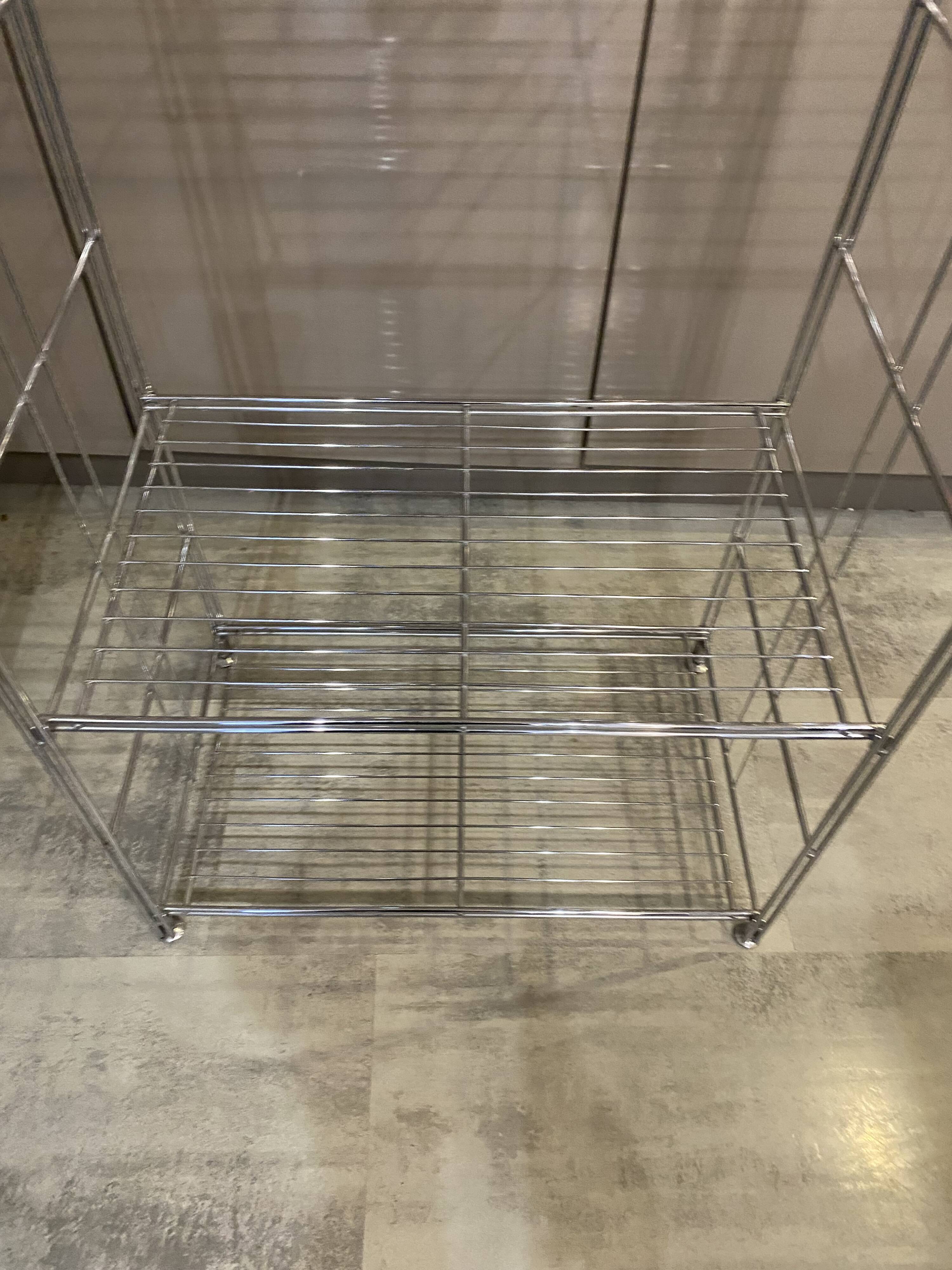 Modular wall bookshelf desk in vintage chrome.