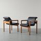 Pair of vintage Flototto armchairs in leather and wood, 1980s.
