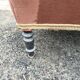 Antique crapaud chair in brown velvet – turned legs and brass rings.