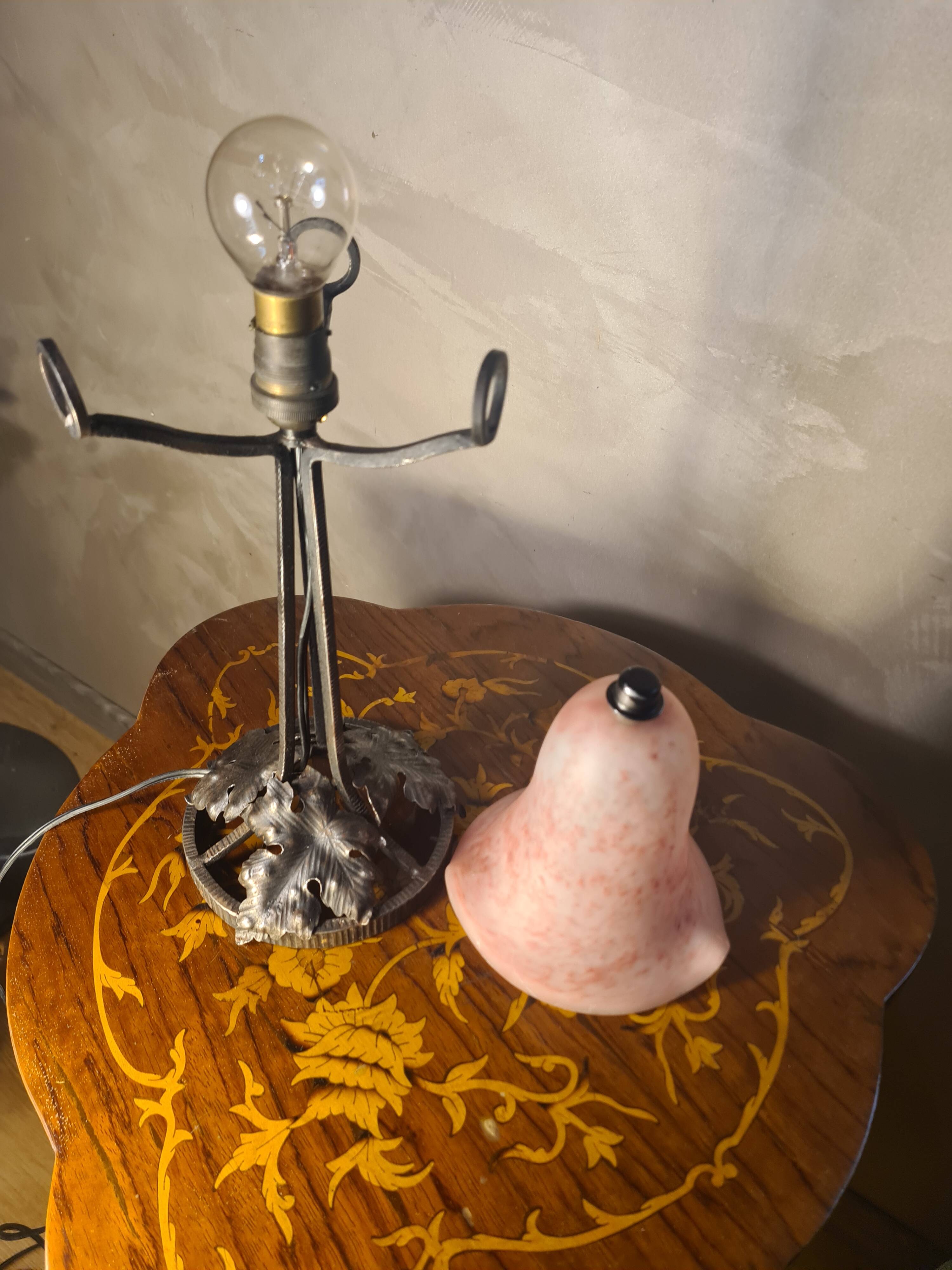 Antique wrought iron floor lamp, 1900, with a glass shade, 40x15.