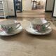 Two luneville cups with saucer