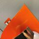 Hanging lamp in chromed metal with orange contrast lacquer and three light sources.