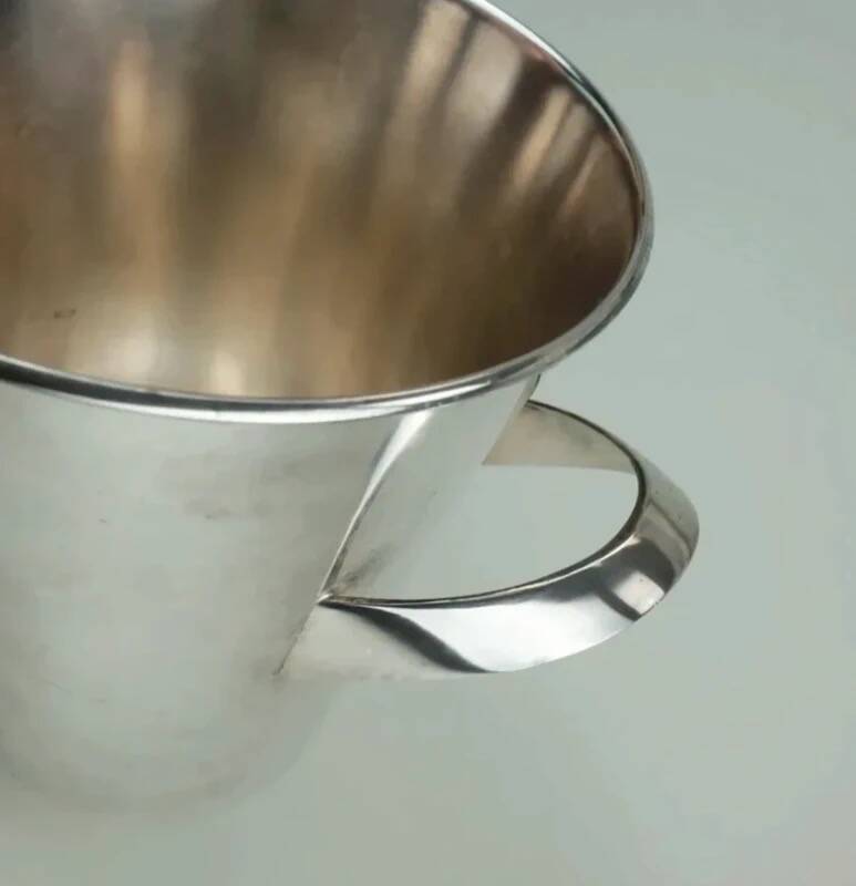 Silver-plated ice bucket with a refined design, designed by Kurt Mayer for