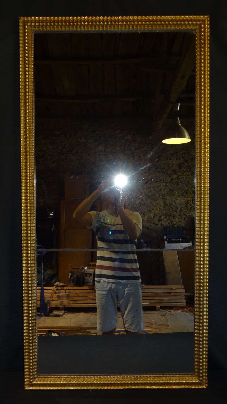 Gilded stucco mirror with gold leaf, H 152 cm