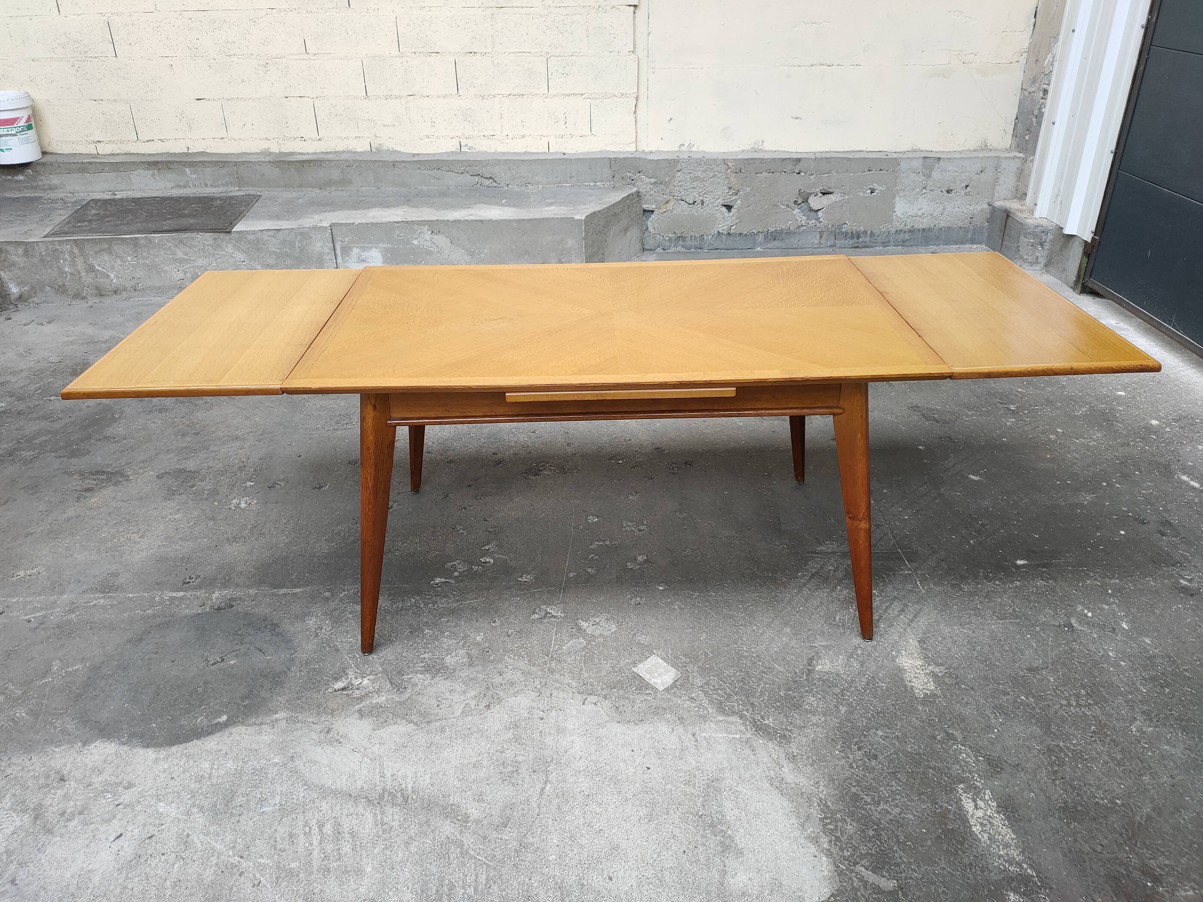 Dining table with oak compass legs