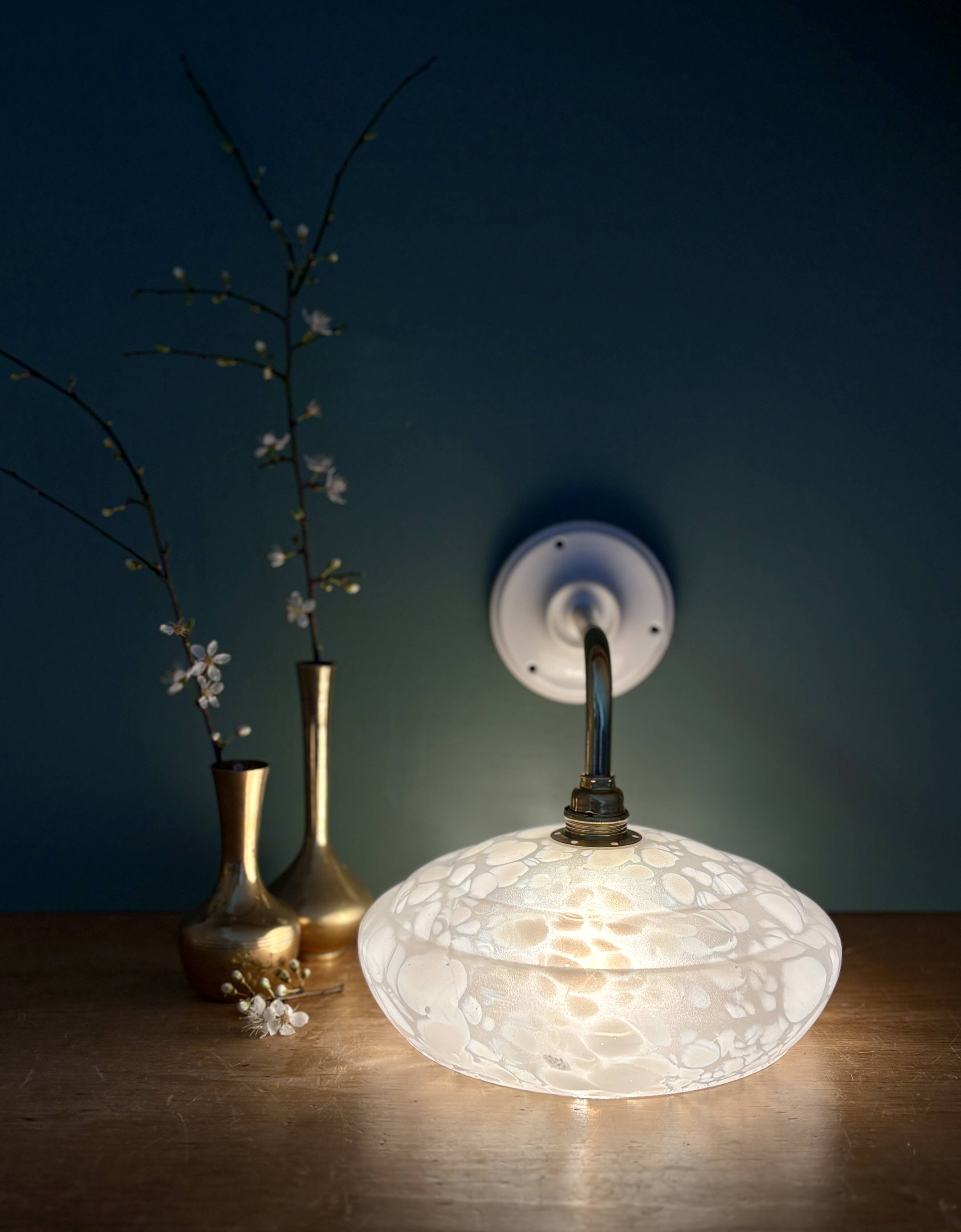 Vintage glass wall lamp with a white Clichy shade.