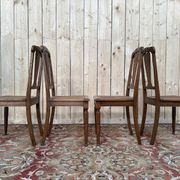 Suite de 4 chaises époque Art Déco en cannage