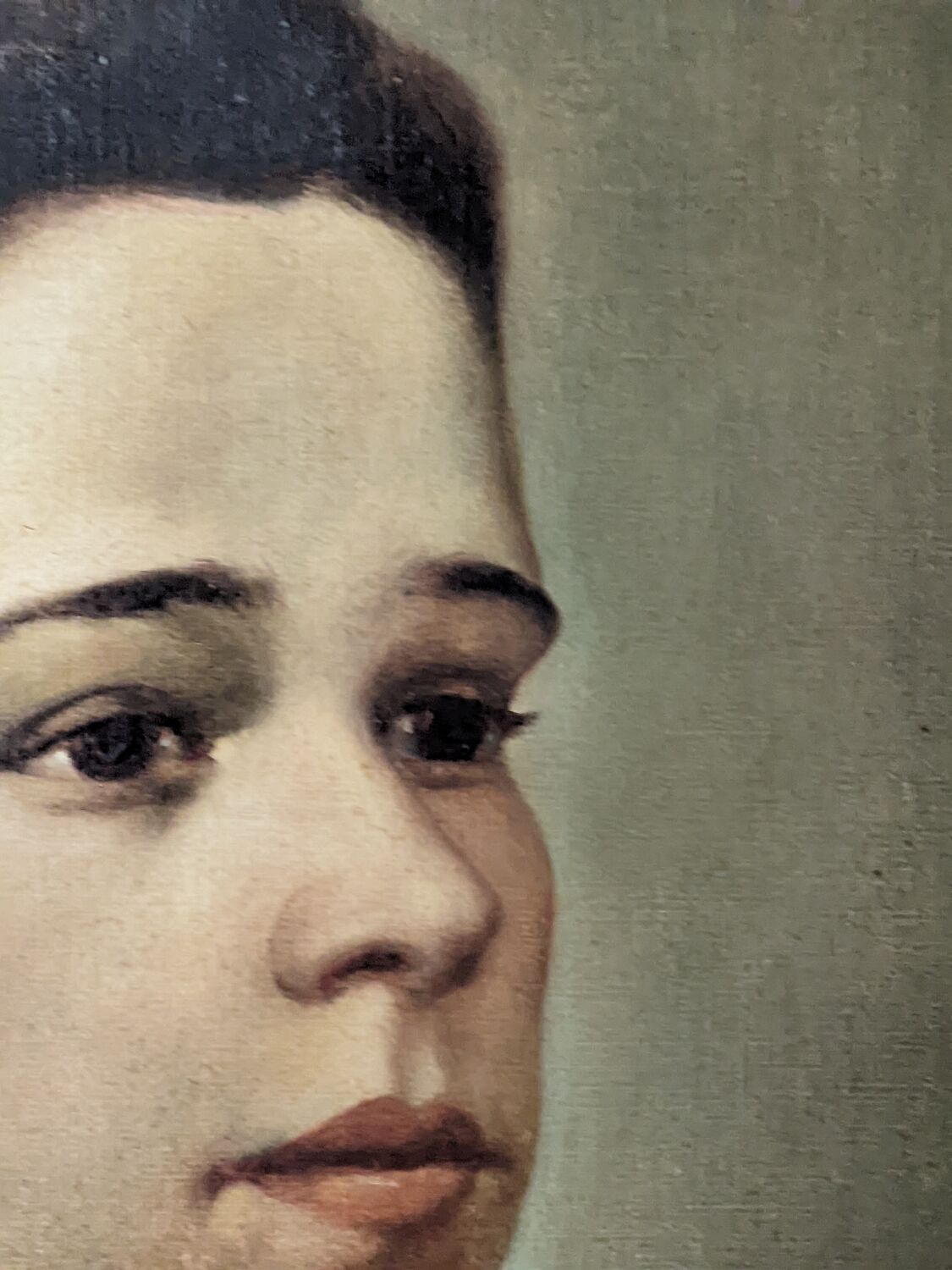 Oil on canvas portrait in an antique gilded wooden frame.